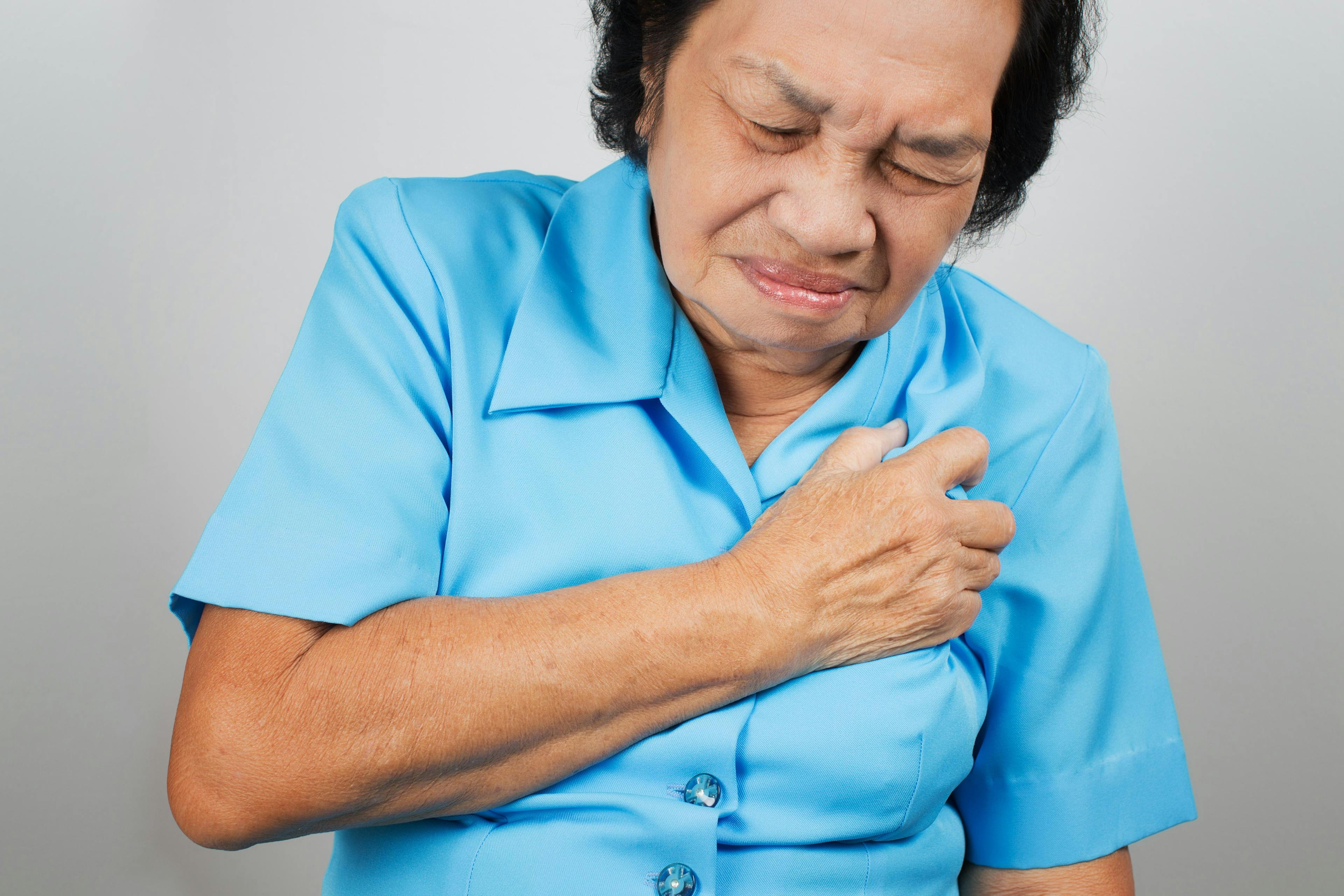 Chinese woman experiencing chest pain.