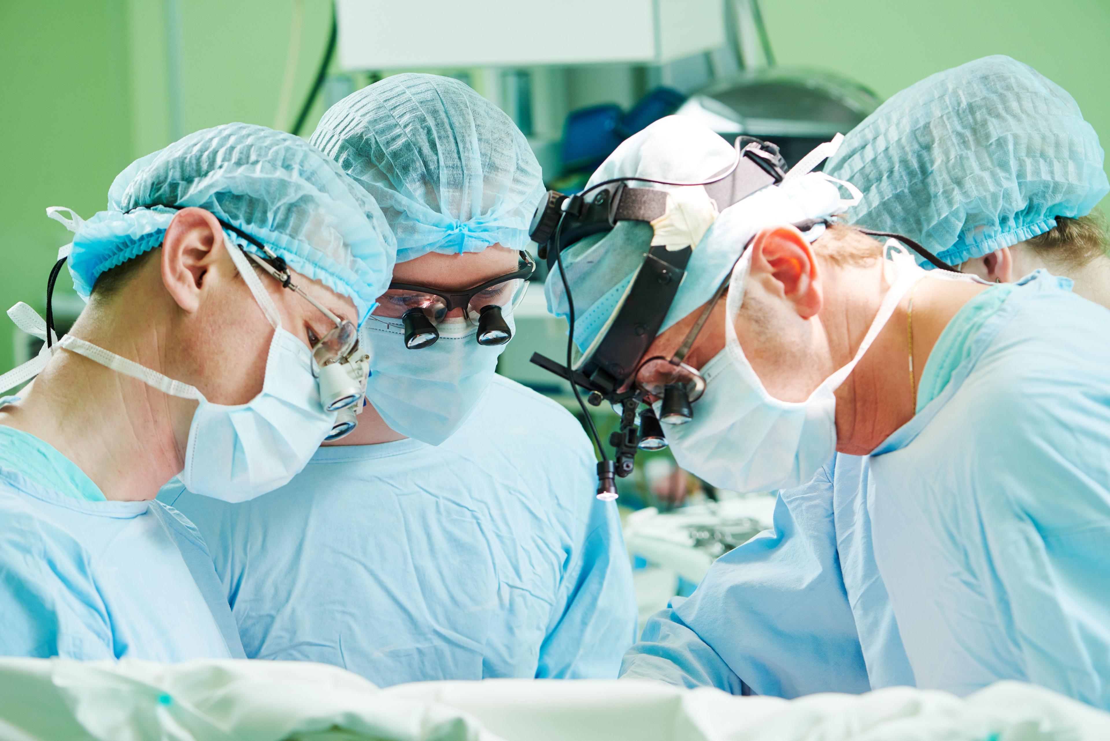 Doctors performing a cardiac catheterization.