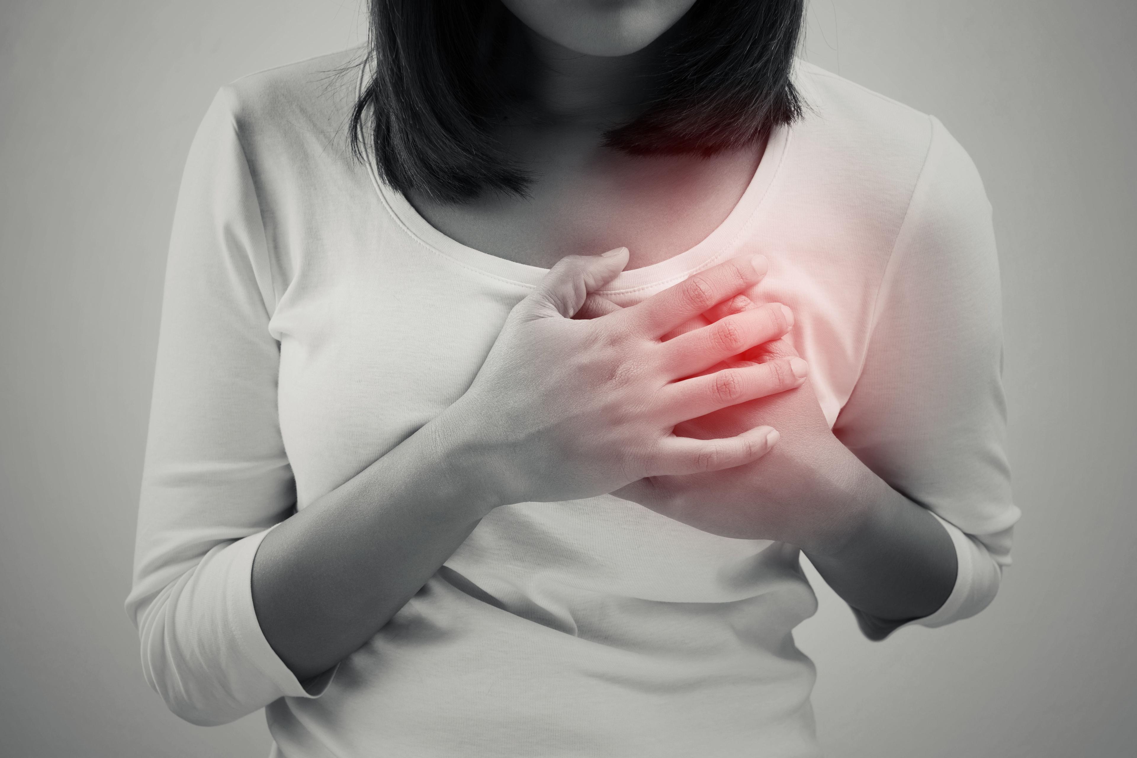 Stock image of a woman experiencing chest pain. | Credit: Fotolia