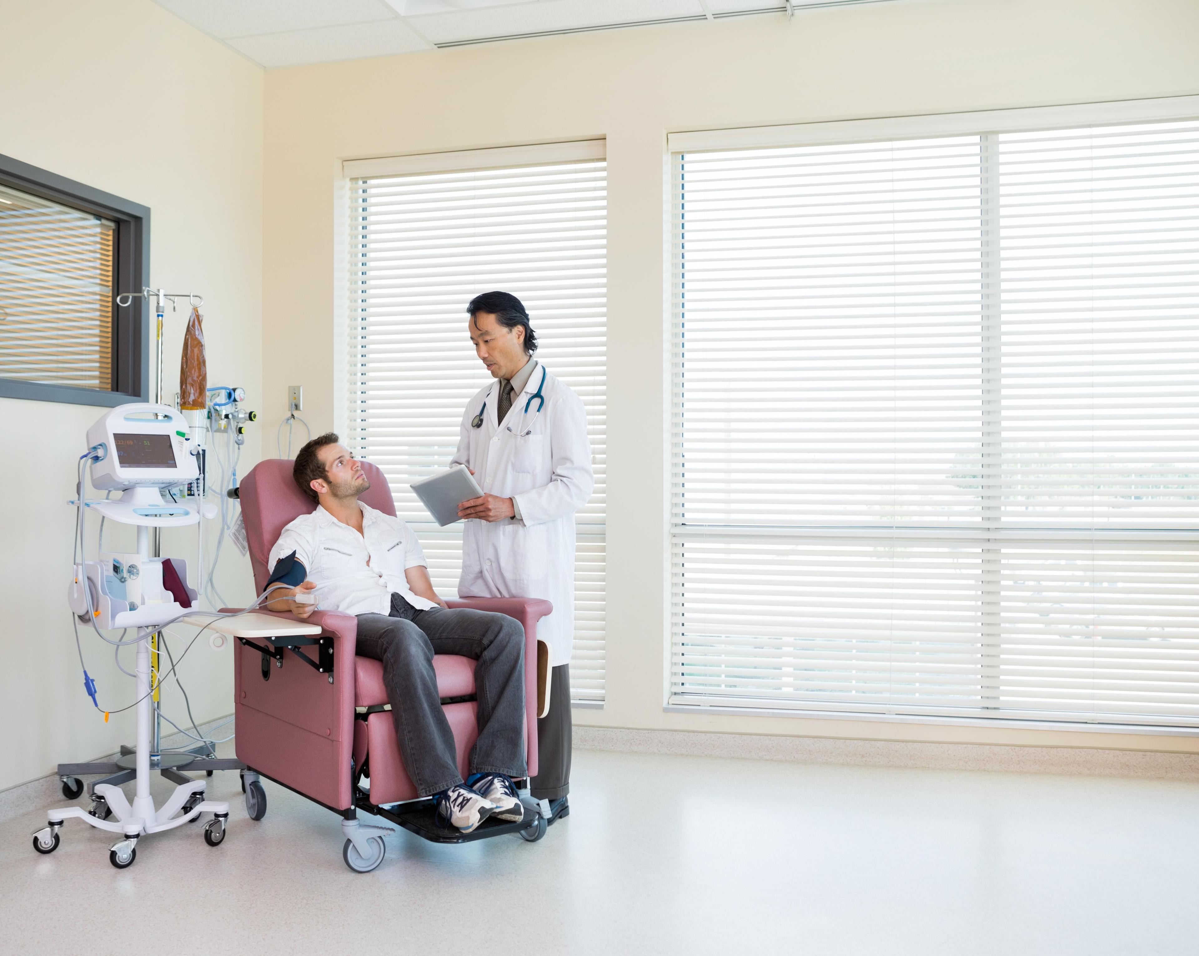 Patient talking to a doctor during chemotherapy.