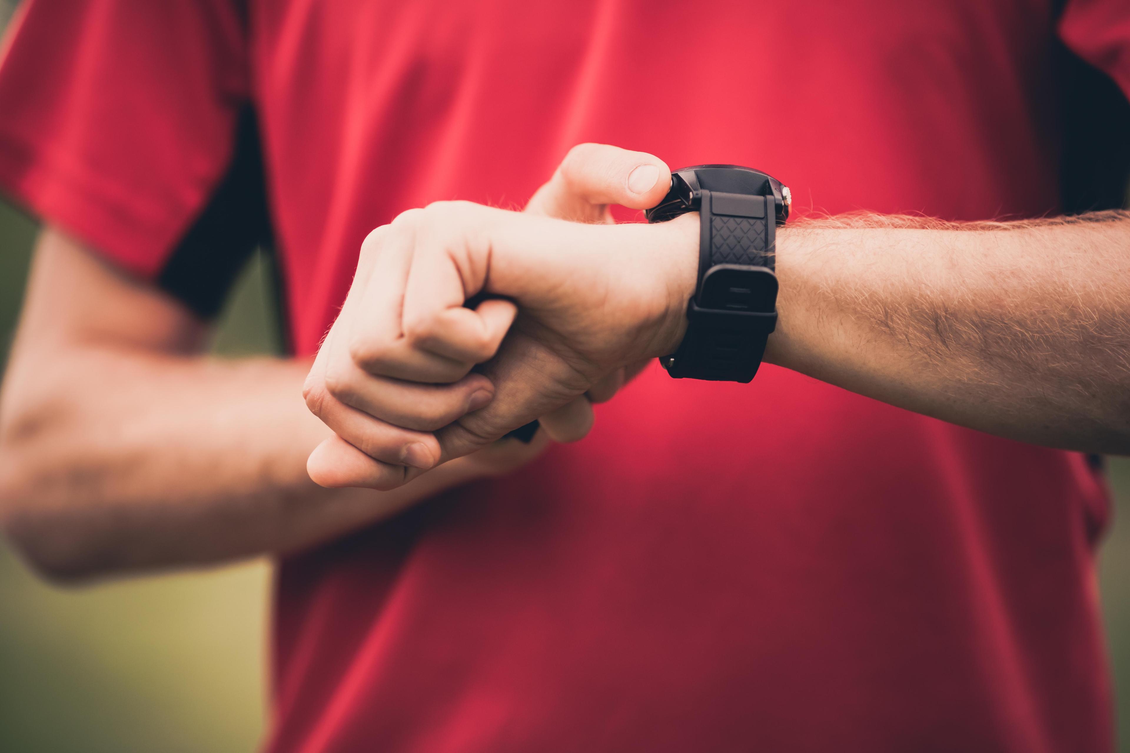 A man checking his smart watch.